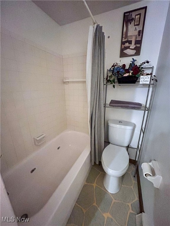 bathroom with shower / tub combo, toilet, and tile patterned flooring