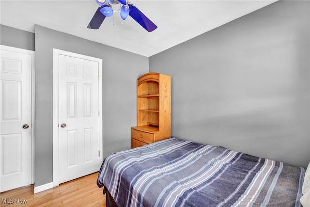 bedroom featuring ceiling fan and wood-type flooring