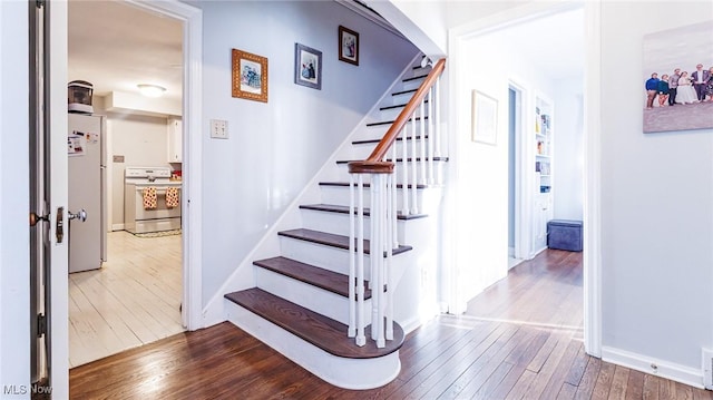 staircase featuring hardwood / wood-style floors