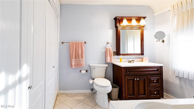 bathroom with tile patterned floors, vanity, and toilet