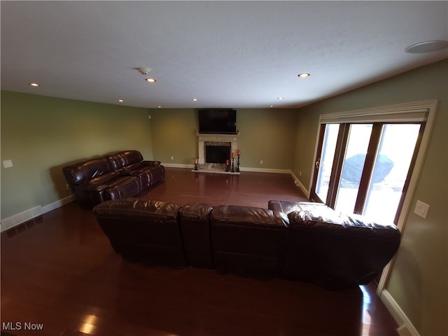 7596 W 130th St, Middleburg Heights, OH 44130 - living room with lofted ceiling, wood-type flooring, and a textured ceiling