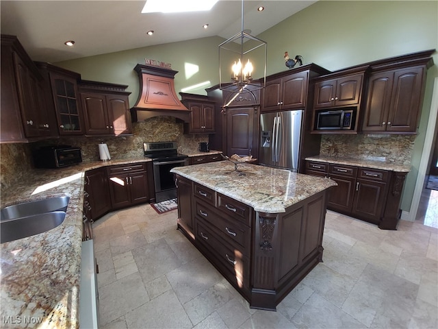 7596 W 130th St, Middleburg Heights, OH 44130 - kitchen with appliances with stainless steel finishes, backsplash, dark brown cabinetry, decorative light fixtures, and a center island