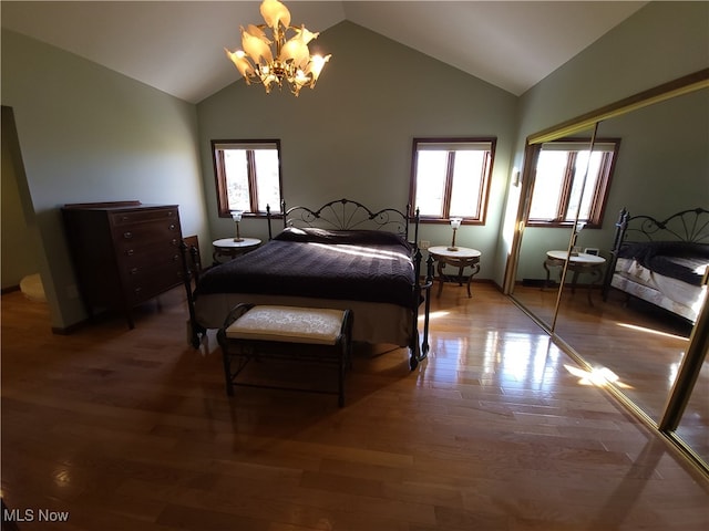 7596 W 130th St, Middleburg Heights, OH 44130 - bedroom with hardwood / wood-style floors, a chandelier, a closet, and vaulted ceiling