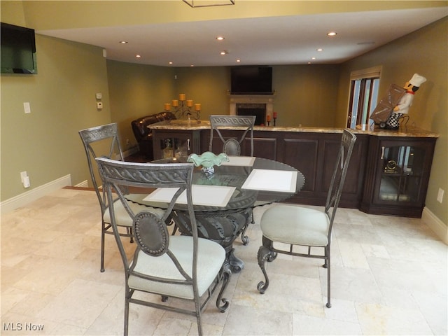 7596 W 130th St, Middleburg Heights, OH 44130 - dining room featuring a fireplace