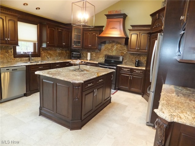 7596 W 130th St, Middleburg Heights, OH 44130 - kitchen featuring sink, stainless steel appliances, an inviting chandelier, decorative light fixtures, and a kitchen island