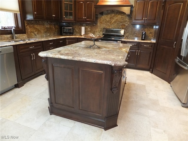 7596 W 130th St, Middleburg Heights, OH 44130 - kitchen featuring dark brown cabinetry, a kitchen island, stainless steel appliances, and custom range hood