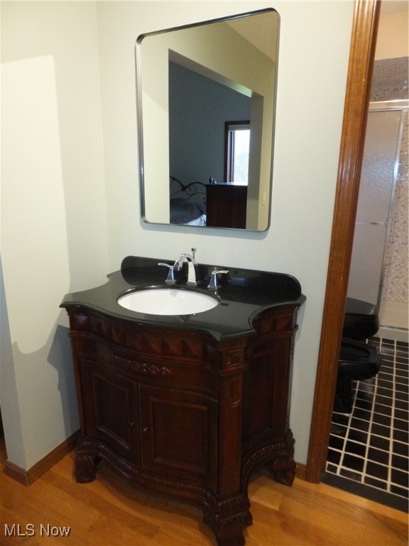 7596 W 130th St, Middleburg Heights, OH 44130 - bathroom featuring vanity and hardwood / wood-style flooring