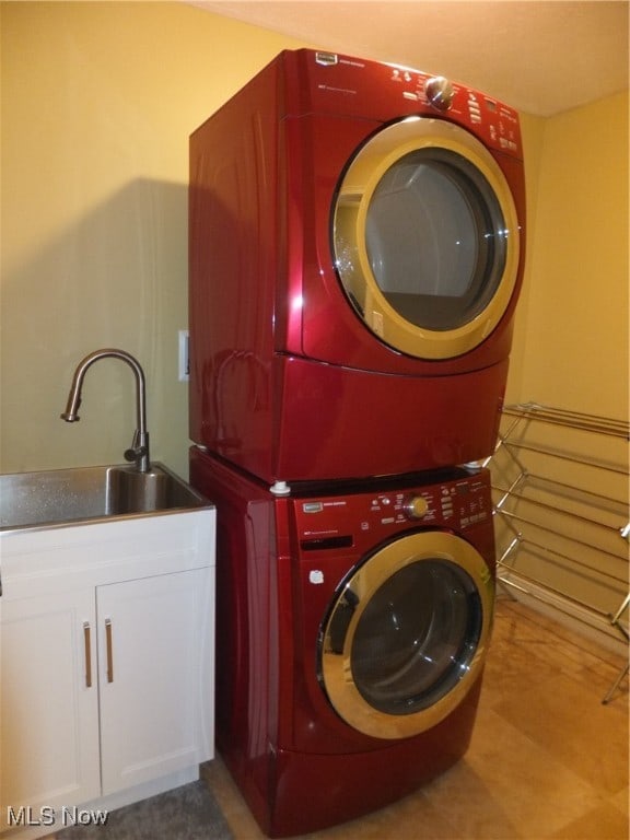 7596 W 130th St, Middleburg Heights, OH 44130 - washroom with cabinets, stacked washer / drying machine, and sink