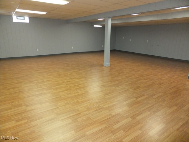 7596 W 130th St, Middleburg Heights, OH 44130 - basement with a paneled ceiling and light hardwood / wood-style flooring