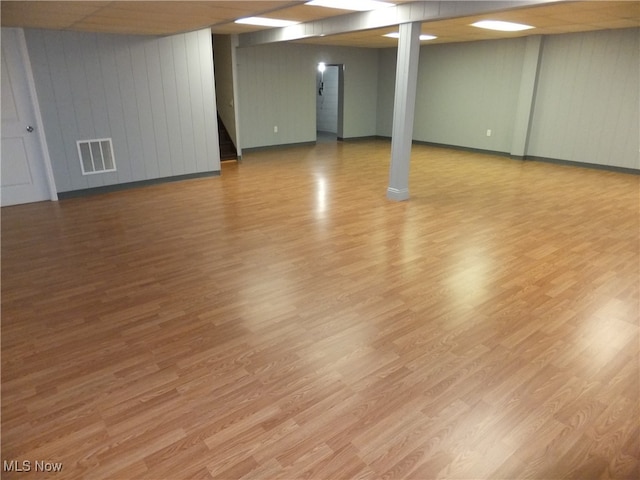 7596 W 130th St, Middleburg Heights, OH 44130 - basement featuring hardwood / wood-style flooring and wooden walls