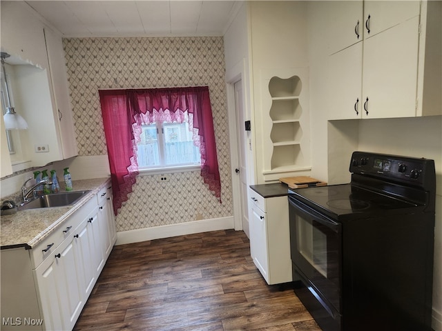 kitchen with dark wood-type flooring, white cabinetry, black range with electric stovetop, and sink