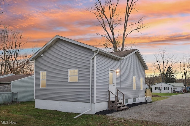 view of property exterior at dusk