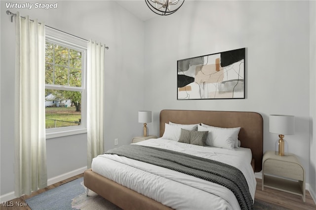 bedroom featuring wood-type flooring