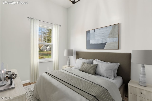 bedroom with hardwood / wood-style floors