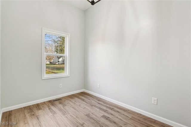 spare room with light hardwood / wood-style floors