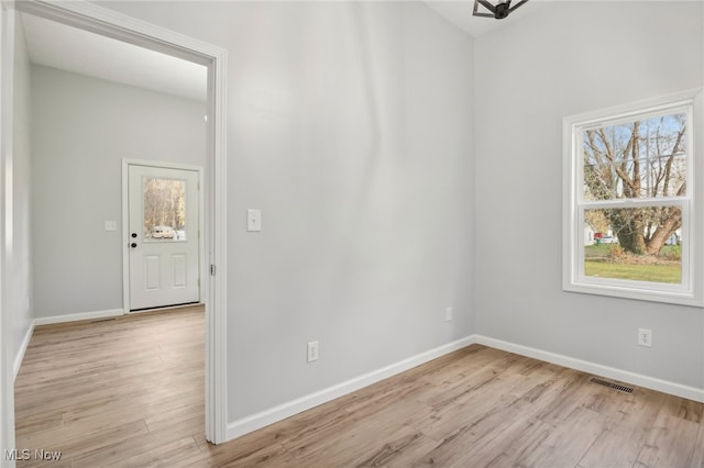 spare room featuring light wood-type flooring