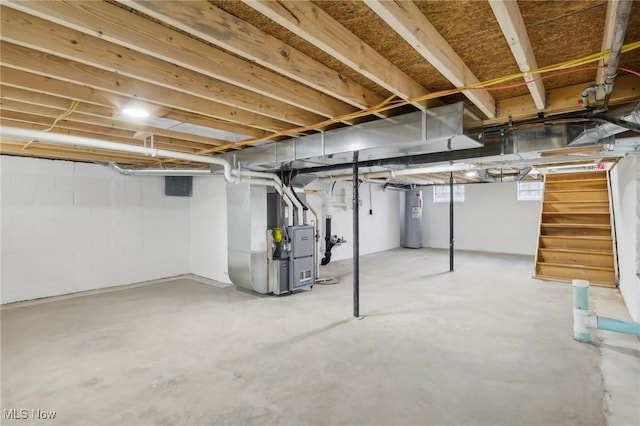 basement featuring electric water heater and heating unit