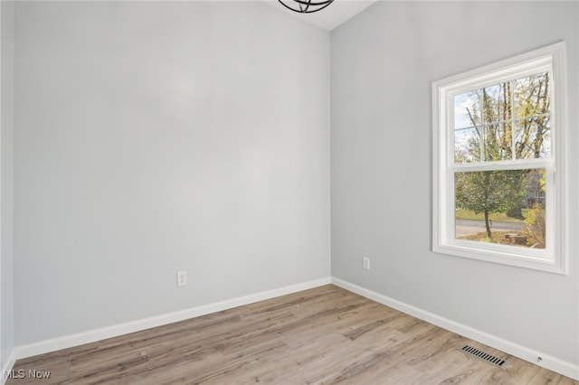 unfurnished room featuring light hardwood / wood-style floors