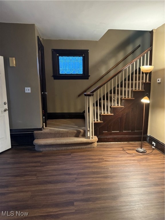 stairway featuring hardwood / wood-style flooring