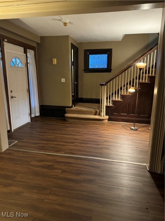 foyer with dark hardwood / wood-style floors