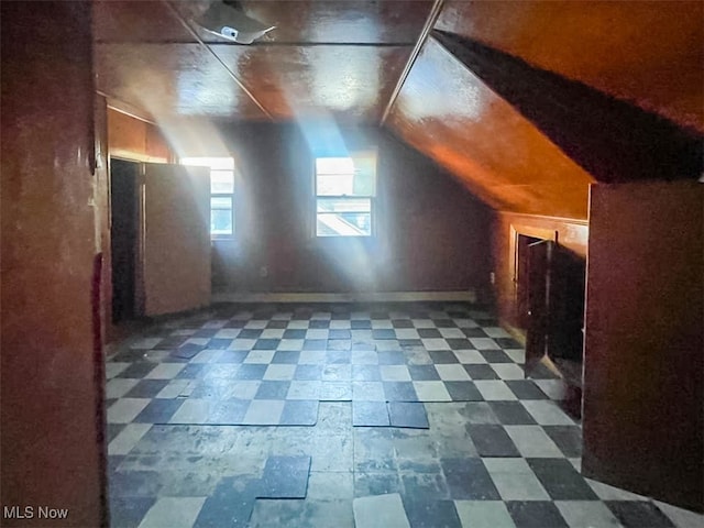 additional living space with lofted ceiling