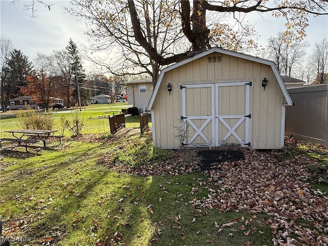 view of outdoor structure featuring a lawn