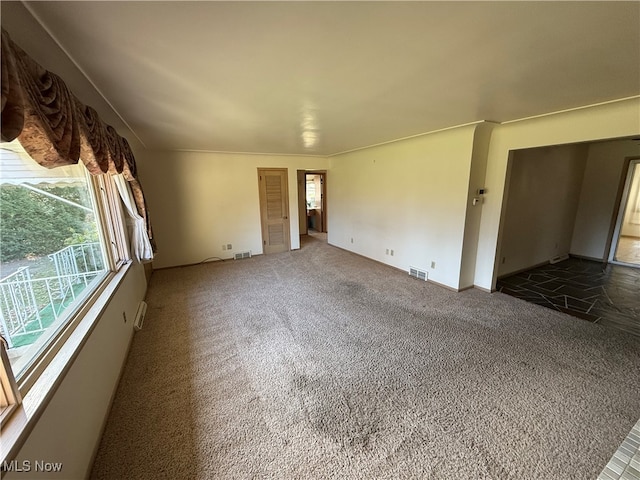 unfurnished living room with carpet flooring