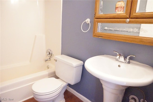 bathroom featuring  shower combination and toilet