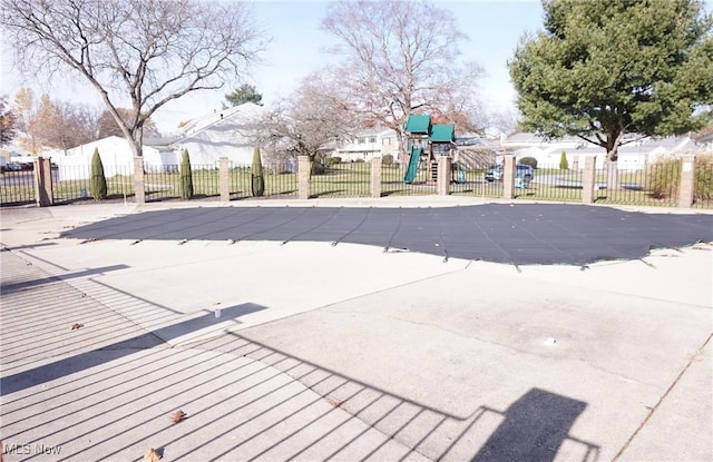 view of pool with a playground