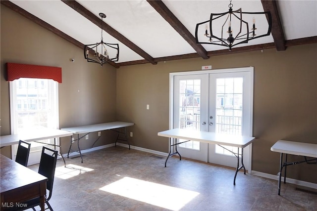 dining room featuring an inviting chandelier, vaulted ceiling with beams, and french doors