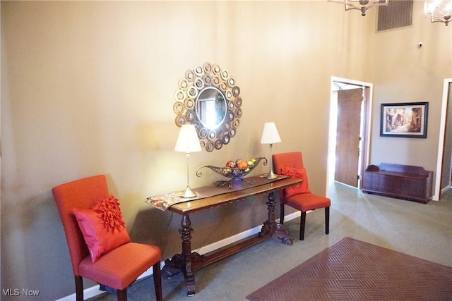 sitting room with a chandelier