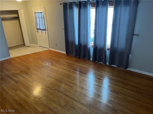 unfurnished bedroom featuring hardwood / wood-style floors