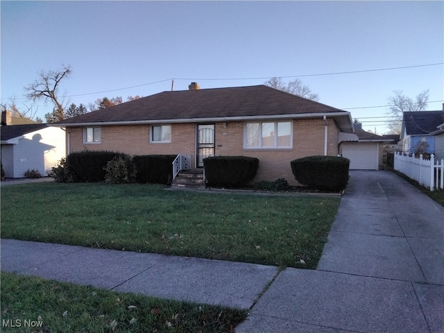 single story home with a garage and a front yard