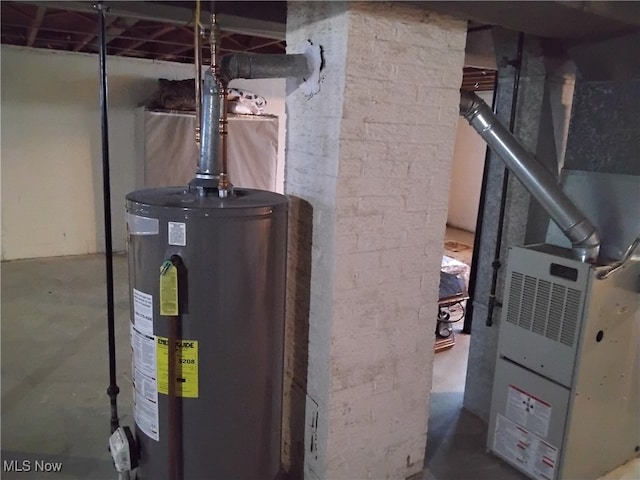 utility room featuring water heater and heating unit