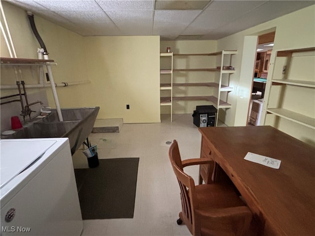 office space featuring washer / dryer and a paneled ceiling