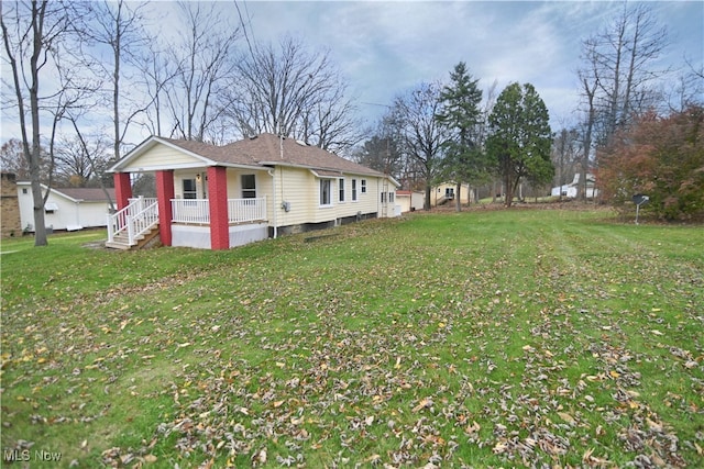 view of yard with covered porch