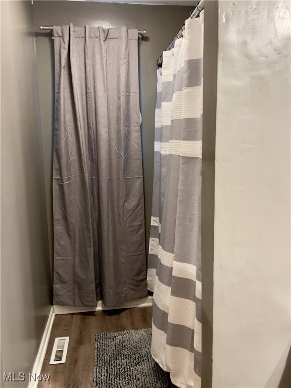 bathroom featuring hardwood / wood-style flooring