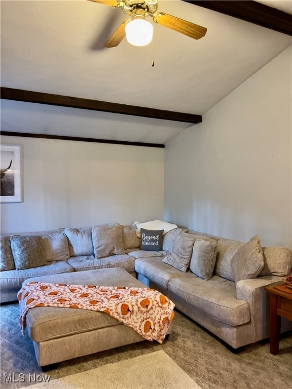 carpeted living room featuring ceiling fan and vaulted ceiling with beams