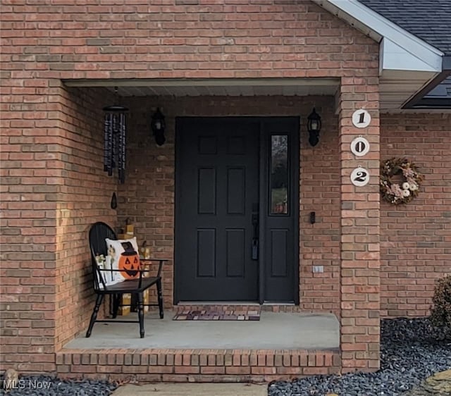 doorway to property featuring a porch