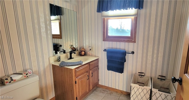 bathroom featuring tile patterned floors, vanity, and toilet