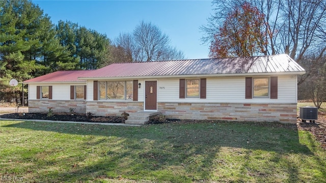 single story home with a front yard and central AC