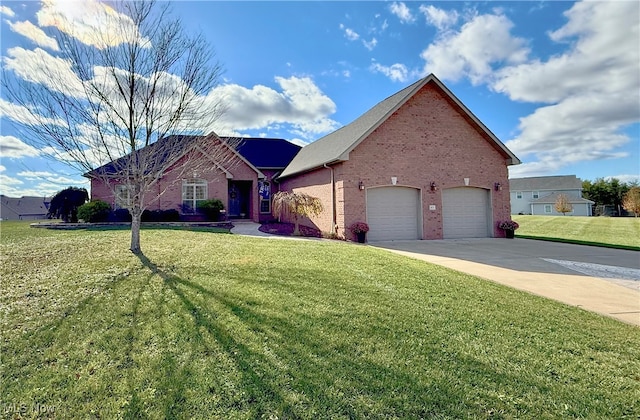 view of front of house featuring a front yard and a garage