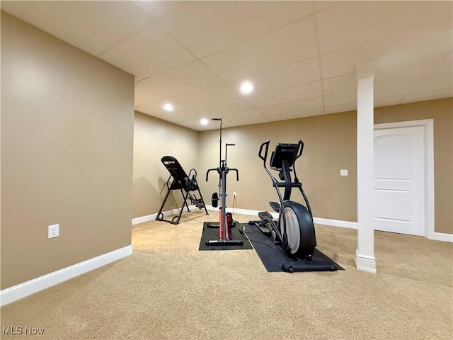 workout room with carpet and a drop ceiling