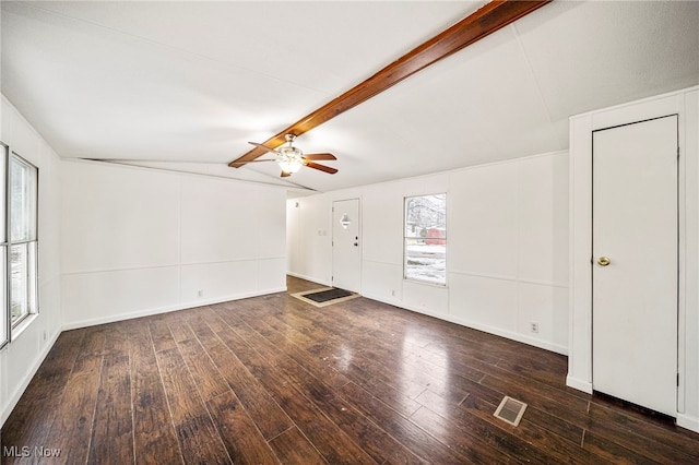 empty room with ceiling fan, vaulted ceiling with beams, and dark hardwood / wood-style floors