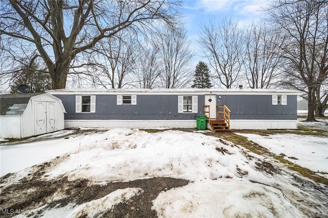 view of front of house with a storage unit