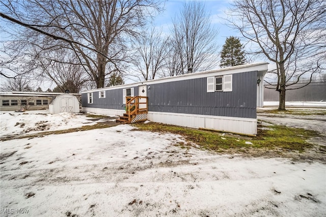 view of front of home with a storage unit