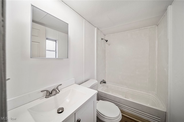 full bathroom featuring vanity, shower / bathtub combination, toilet, and a textured ceiling