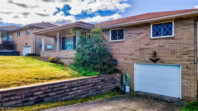 view of home's exterior with a lawn and a garage