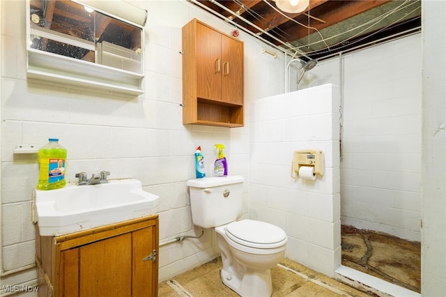 bathroom featuring walk in shower, vanity, and toilet