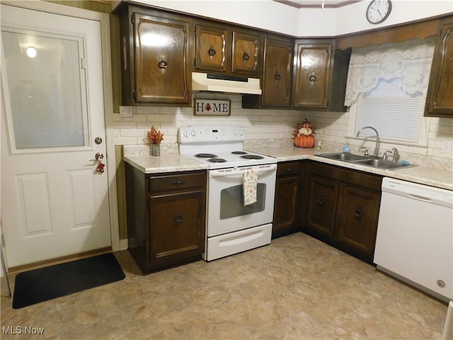 kitchen featuring white appliances, tasteful backsplash, dark brown cabinetry, and sink